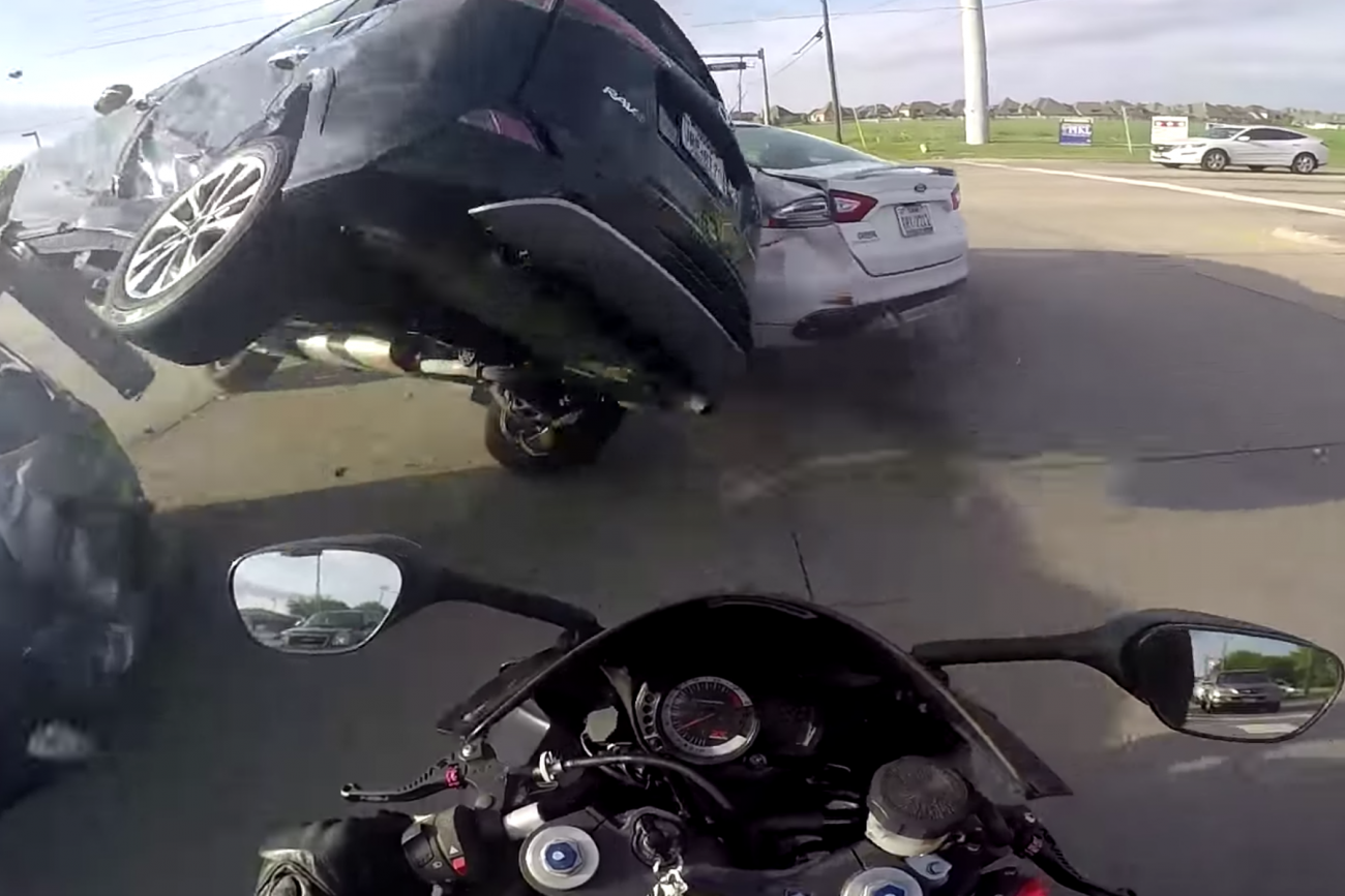 Video: Motorcyclist Survives Insane Car Accident